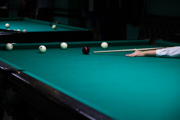 Sports game of billiards on a green cloth