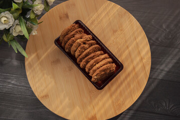 Healty diet fig and oatmeal cookies on a wooden surface 