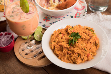 Arroz con mariscos Sea food risotto ceviche Assorted food plates Peru traditional comfort food buffet table