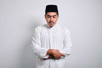 Asian muslim man doing praying to god or shalat