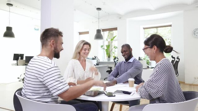 Business multi-ethnic team working together in a meeting.