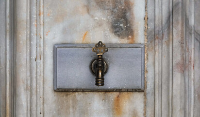 Close up view of brass faucet on public water fountain with its old marbel wall, Public bronze faucet fountain in old Ottoman  traditional style. city Istanbul