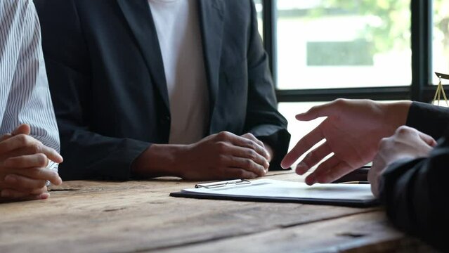 Attorneys or lawyers who are reading the statute of limitations Consultation between male lawyers and business clients, tax and legal and legal services firms.