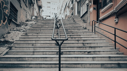 An old stairway stuck between narrow streets - Powered by Adobe