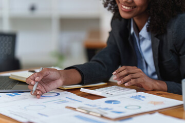 Accountant black woman working on laptop and do document, tax, exchange, accounting and Financial advisor concept.