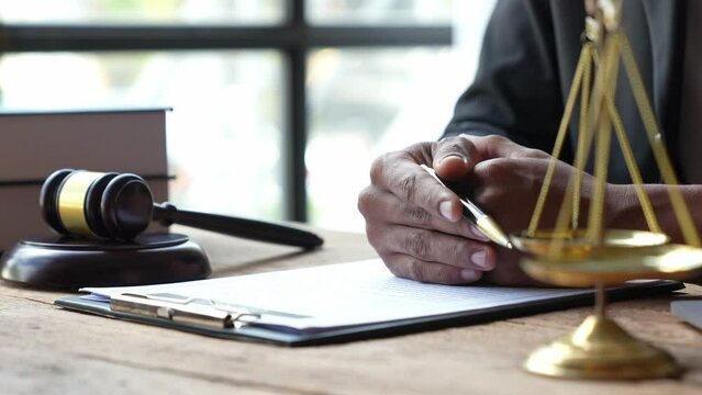 Attorneys or lawyers who are reading the statute of limitations Consultation between male lawyers and business clients, tax and legal and legal services firms.