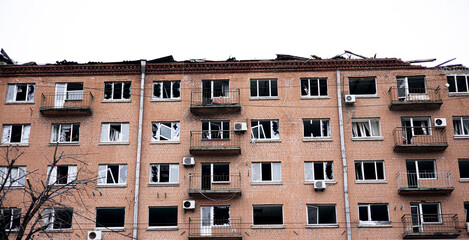 Fototapeta na wymiar War of Russia against Ukraine. View of a civilian building damaged following a Russian rocket attack the city of Kyiv, Ukraine