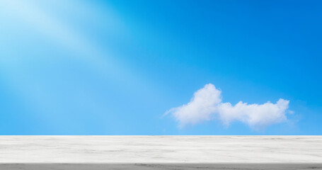 Marble top table with fluffy cloud on Blue sky background,Backdrop background Horizon banner Nature...