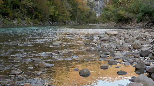 Arkansas Buffalo national river of the Ozark mountains with green mineral water and yellow reflection