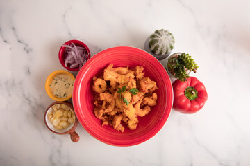 Chicharron de pota chicharron fish sticks Sea food ceviche Assorted food plates Peru traditional comfort food buffet table