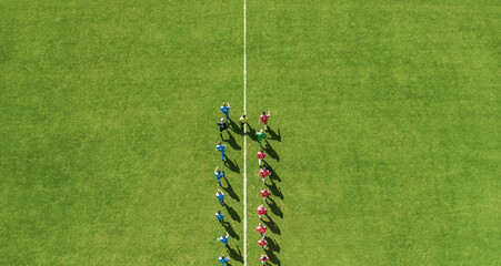 Aerial Top View Shot of Soccer Championship Match Beginning.Two Professional Football Teams Enter Stadium Field Where they Will Compete for the Champion Status. Start of the Major League Tournament