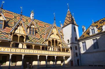 Traditional house architecture of hospice in Beaune, Burgundy, France - 573942244