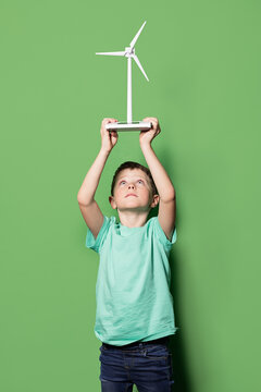 Smiling kid with windmill mockup overhead