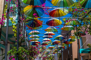 A view up Umbrella Street in Puerto Plata in the Dominion Republic on a bright sunny day