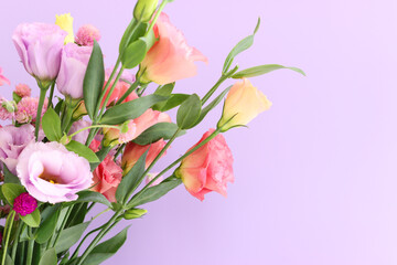 Top view image of pink and purple flowers composition over pastel background