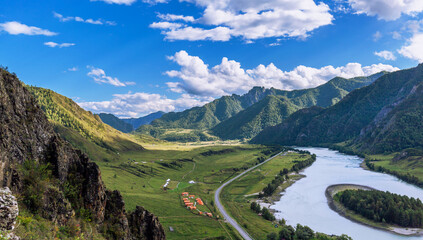 Fototapeta na wymiar Colorful view of the mountains and the Katun River, with an island in the Altai Mountains, Siberia, Russia. View from the observation deck in the mountains. The concept tourism