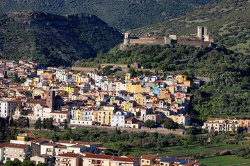 Naklejka premium Homes and Apartments in Touristic Town. Bosa, Sardinia, Italy. Sunny Fall Season Day.