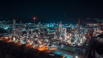 Fototapeta na wymiar industrial area production plant or refinery crude oil and gas for transportatioon and export, aerial photography at night scene from drone,