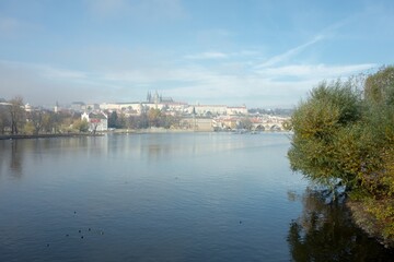 Fototapeta na wymiar Panorama of Prague capital city in morning fog with Vltava and Prague Castle