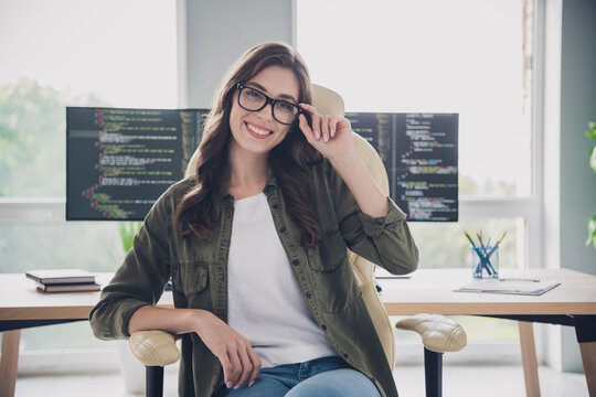 Photo of smiling charming lady programmer wear eyeglasses finish work modern device indoors workplace workstation
