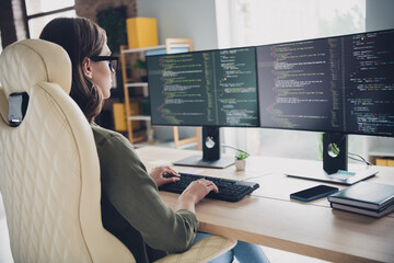 Photo of serious cool lady system admin wear eyeglasses checking framework indoors workplace...