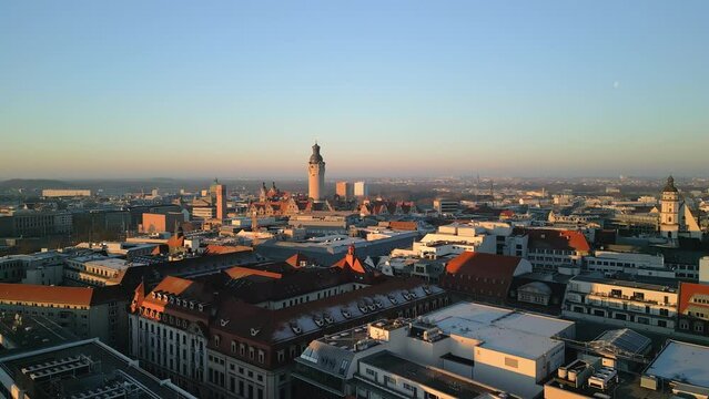 Aerial view of the German city Leipzig in Saxony during the sunrise. Drone footage during golden hour. 4K