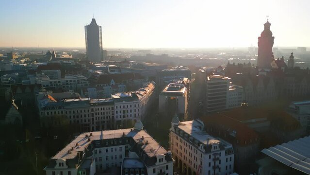 Aerial view of the German city Leipzig in Saxony during the sunrise. Drone footage during golden hour. 4K