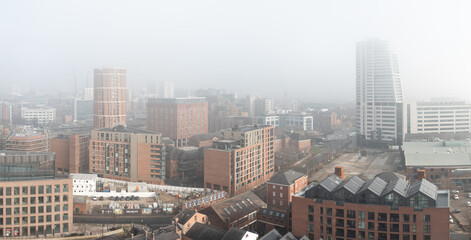 Fototapeta na wymiar Aerial panorama of Leeds cityscape skyline in fog and mist