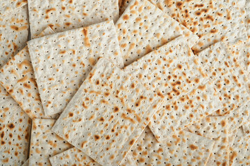 Passover celebration concept. Matzah texture background. Passover food. Pesach Jewish holiday. Traditional ritual Jewish bread. Passover food. Top view, flat lay. Mock up.