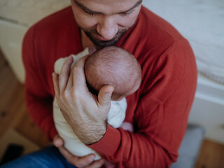 Close-up of father holding his little son.