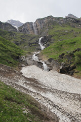 Waterfalls on the way to mountain water reservoirs in Kaprun, Austria