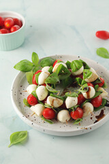 A plate with Italian salad caprese canape	