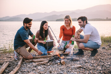 Happy friends meeting at campground, Group of diverse people enjoy camping with friends at campyard...