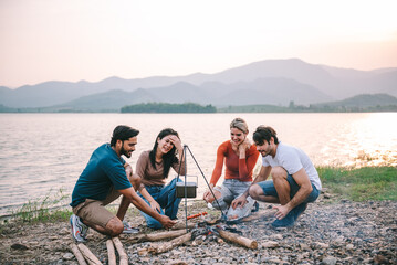 Fototapeta premium Happy friends meeting at campground, Group of diverse people enjoy camping with friends at campyard on vacation