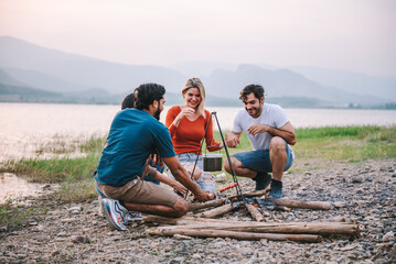 Happy friends meeting at campground, Group of diverse people enjoy camping with friends at campyard on vacation