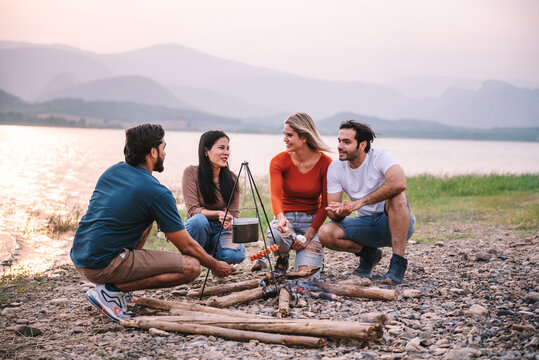 Happy Friends Meeting At Campground, Group Of Diverse People Enjoy Camping With Friends At Campyard On Vacation