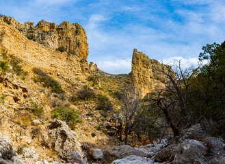 Hiking Trail Through Boulders and Streambed on The Devil's Hall Trail in Pine Springs Canyon, Guadalupe Mountains National Park, Texas, USA