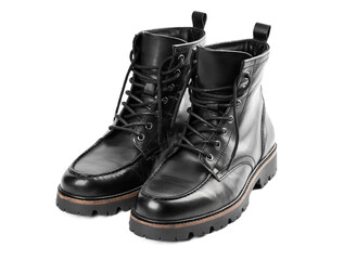 Pair of black leather boots, dress boots for men, men ankle high boots. Black brogue boots on a white background. Men fashion in leather boots. Man's legs in black jeans and brown leather boots.