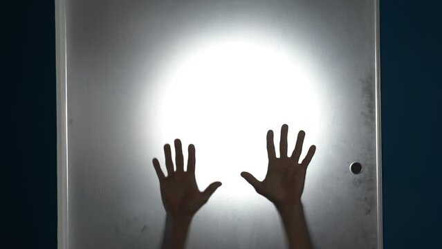 hands and body of raped woman silhouette- domestic family sexual violence at home in apartment - increase in rape and gender-based abuse - shock and fear due to a feminicide