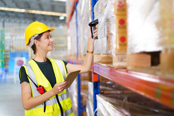 Happy cheerful caucasian white female warehouse worker using laser barcode reader to scan stock inventory in warehouse. - Powered by Adobe