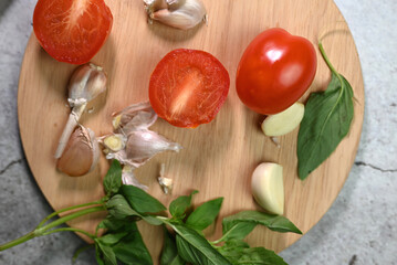 fresh tomato with garlic and basil leaf, salad ingredients