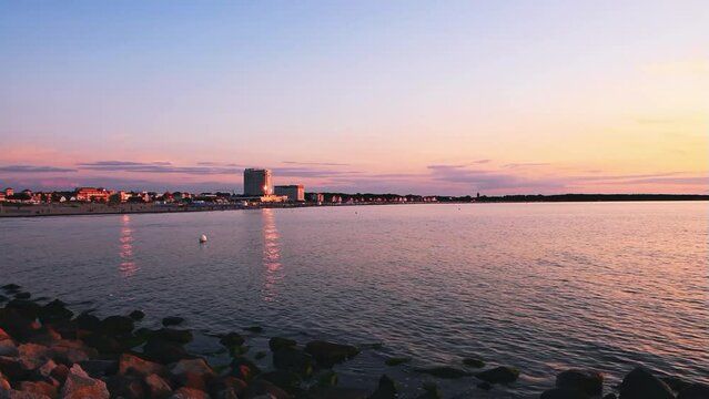 A panoramic view over Warnem&uuml;nde Beach in Mecklenburg-West Pomerania (Germany) and the Baltic Sea at sunset - AUGUST 02 2021.