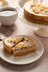 Caramel cheesecake slices and served with cup of tea
