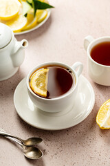 Cup of black tea and lemon slice. Slow living, drinking tea.