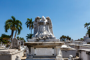 Rich decorated grave with a mourning angel statue at the Santa Ifigenia Cemetery in Santiago de Cuba, Cuba, Caribbean