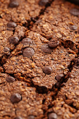 Close-up brownies with chocolate chips and rolled oats, macro texture.