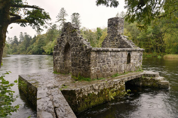 Fototapeta na wymiar The monks fishing house at Cong Abbey, Co. Mayo, Connacht, Ireland. 15th or 16th C built over the River Cong to catch fish for the Augustinian abbey
