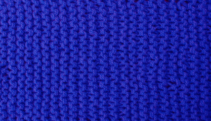 Hit natural texture of knitted wool textile material background.