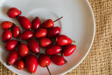 Ripe rose hips harvested for making preserves for the winter, close-up. Healthy eating.