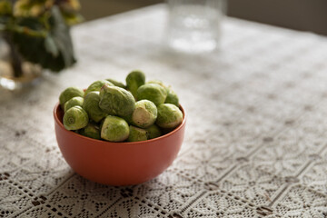 Brussels sprouts in a clay pot, healthy vegetables.